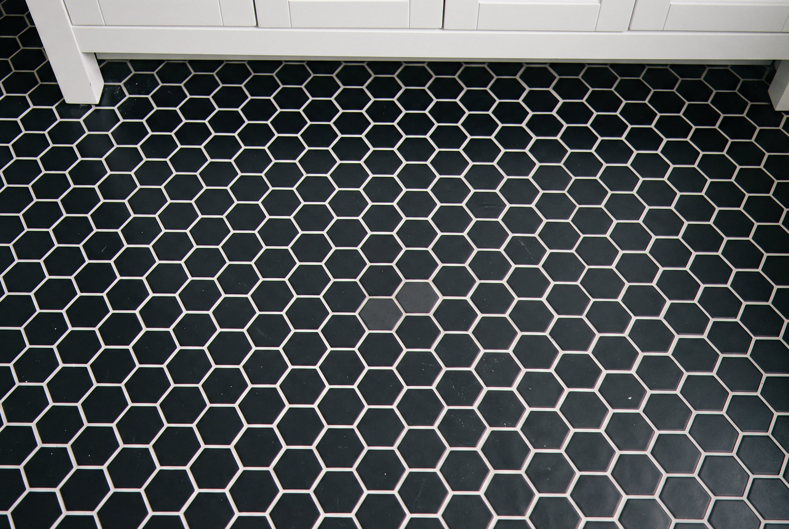 Hexagon tile bathroom floor set in white