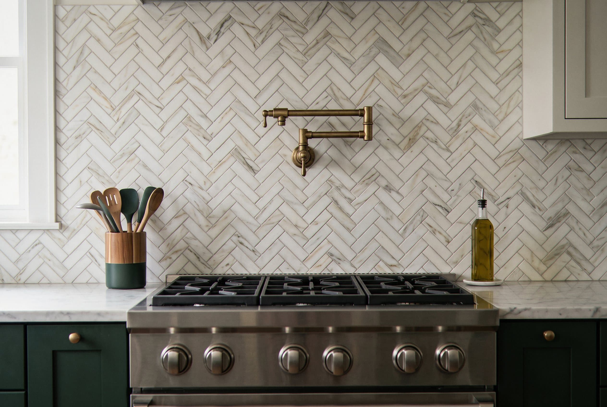 Herringbone pattern tile backsplash in a kitchen